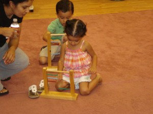 cute little girl playing the abacus